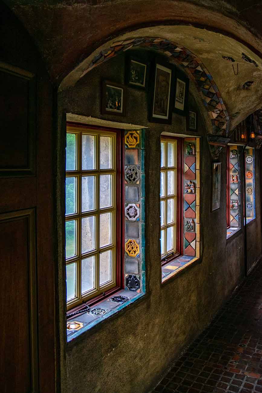 View down a tiled hallway in Fonthill Castle in Doylestown, PA