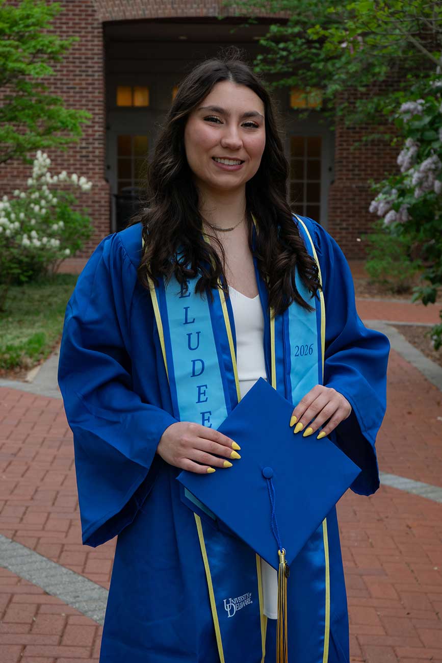 Caitlin wearing her University of Delaware graduation regalia