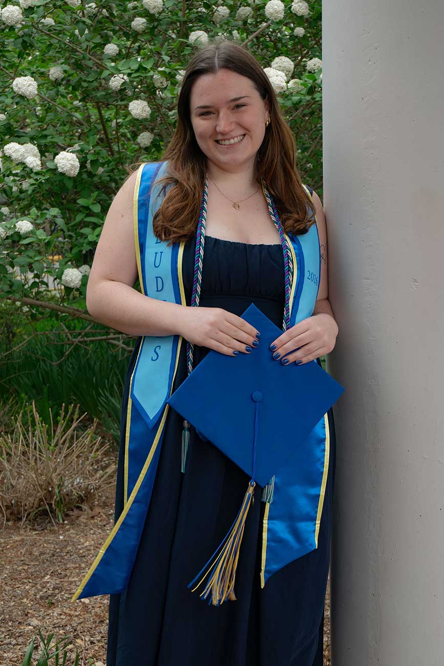 Chase wearing her University of Delaware graduation regalia